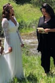 This dress was absolutely perfect! The only negative I have is that it was long for me. I had it hemmed. Cost more than the dress did but it was worth it to not step all over it the entire day. I bought both small and extra small. Extra small was the winner. I have had so many compliments from my wedding pictures and my family loved it as well. Perfect mountain wedding with the love of my life! - Katelyn L.