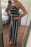The fit and length is perfect. I have long legs and although I won't be able to wear heels with it, it's going to be perfect for any flats. The top ties up and the bottoms have an elastic band in the back to allow a tailored fit. I can't wait to wear this outfit out! - Mandi W.