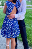Bought this dress to wear to a friends wedding, really loved the open back on this dress and how fun and flirty it was. Fits perfectly, I got an XS and it was a great length on my body. Was worried that it would come out longer but it was perfect. - Gracelyn F.