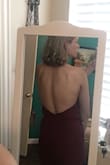 I absolutely LOVE this jumpsuit!!! I'm wearing it for my best friend's wedding in November, and it's absolutely PERFECT! It fit wonderfully, and I LOVE the open back. Depending on if you have a bigger bum or more muscular/thick thighs, it may be slightly snug around those areas like it was on me (dancer), but I can still sit and walk just fine! It just doesn't look quite as big around the thighs as on the model. Overall it's amazing and I wouldn't change the size due to me not having a big enough chest for the medium! I can hardly fill out the small. You won't regret ordering this! It's to die for!!!!! - Hannah H.