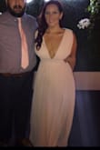 Wore in a destination wedding. There is no give in the waist band so it felt a little snug, but it provided great structure to define the waist and make me feel pretty. The fabric feels and looks high-quality, the color was perfect. The cut is obviously low in front and back, I used gaffer tape to secure the girls and I LOVED the look/fit. Seriously people would not stop telling me how much they loved it! - Amy W.