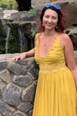This dress is gorgeous, and I love the color. The top is extremely low cut and was a little too revealing for me though. I tried to have it altered by having them sew the lace detailing together so it kind of covered up more, but I still have only worn this once because of how revealing it is. - Rachel K.