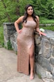 This dress was absolutely perfect! The material was thick and not cheap and the dress stayed up well. The slit was a little higher than I was anticipating but it worked anyway. It was the perfect length, just at floor level with 3" heels. I wore it for my boyfriend's prom and got so many compliments. Flatters any body type I HIGHLY recommend! - Aryanna O.