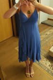 This dress has really nice movement and looks great when I turn slightly to the side. However, when I face full front it's a little frumpy looking as my hips and waist disappear under the fabric. Maybe it will be a little better paired with taller heels? I would also say it's slightly on the small side but can be really adjustable because of the way it wraps. I'm not sure if I'll keep it or not. - Brittany M.
