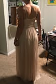 I ordered this as a bridesmaid's dress for my friends wedding. The fabric is a lot heavier than I expected but for the price, the quality was great. If I had another reason (outside the wedding) to wear a champagne colored dress, I would definitely wear this one! It's exactly like the website. The waist is a little bit big on me, but that's a common problem for dresses and my body type. The other thing was that it's pretty long. I wore 2" block heels in the photos below and it still trailed on the floor. Overall, if you're looking for a cheap but beautiful option for a wedding (brides, be nice and pick something reasonable!) this is a great option! - Lexi B.