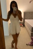 Bought this for a trip to Miami, love the length on my legs even though I'm shorter. Can't wear a bra with it, but it's adorable and perfect for hot weather. Fits a little loose on the sides. - Sierra X.