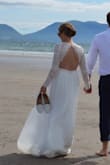 I wore this dress for my wedding. She was perfect. The fabric is of good quality and does not crease. The cut is doing very well. I only had to adjust the width of the sleeves and the seam to the shoulders to make it tighter otherwise the rest fit me perfectly. I highly recommend this dress. - Lanie R.