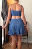 The color is beautiful and it's super cute and comfortable. Medium was the correct size for me. The top fit surprisingly well even though there is no zipper (elastic back). The skirt sat higher on my waist than I expected, maybe because of my pear shape (big hips). Overall, it wasn't as flattering on me in the stomach and legs as I expected. Great for mixing and matching tops and bottoms, but I decided I wouldn't end up wearing it much and it wasn't worth the price tag. - Elise F.