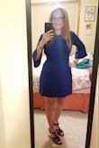 This dress is pretty amazing! I'm usually between a small and medium. I went with the medium after I read reviews. I'm glad I went with this size. The color is beautiful. The material is thick. Has very little stretch but not a lot. The tie is nice as it could be tied in front or in back. I'm happy with this purchase. - Jennifer D.