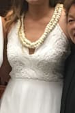 This was perfect for my courthouse wedding! I was able to wear a strapless bra. You could go braless, but I like padding to help add a little. The material is quality. Thick and not see-through. The back straps are SO PRETTY TOO. Excellent quality for a great price. If you're shorter, you may need to hem this.I'd guess that unless you're 5'10 this may drag without altering. I got many compliments, and for me the best part is the lace front. The scalloped lace looks so feminine in my photos. Thanks, Lulus! - Linette K.