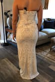 I ordered this dress thinking I could spend a little to add a slit and adjust it so it would be perfect for my wedding. It fit really well and the only reason I'm giving it three stars, areas where the sequins were- already had pieces missing and sequins coming off. This is sadly not worth $250 for the material. - Hannah D.