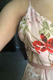 Beautiful dress! The material is amazing and extremely comfortable. However, I did have to hem it because it was much longer than I preferred with heels. It also has a very low V cut, which I am not the biggest fan of. Seems to be made to fit a tall lady with no chest. The sides of the chest do gap a bit which is frustrating (added a picture of it). However, a seamstress could probably fix this, too. The strap around the waist is a bit questionable, too, since it seems to awkwardly wrap above the back of the dress. I would recommend this dress to someone with a smaller chest and who has no problem taking it to the seamstress! - Katie H.