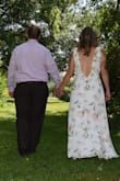 As soon as I tried this dress on I fell in love with it! The material is so light and comfortable, and it fit really well! It fit perfectly everywhere except was just a teeny bit snug at the top of the zipper, so I had it altered to lower the top of the zipper an inch and it was perfect. I wore it for my backyard wedding and was comfortable and felt beautiful all day with no issues moving around! Really love the adjustable shoulder so you can make it sit exactly where you want it to. I got so many compliments and loved all the pictures! - Elise M.