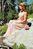 Ordered this for my elopement wedding and it's the perfect dress. Ordered two sizes. The reviews say runs small but ordering up was too large. I ordered M and L and the medium is perfect. The dress should be closely fitted or it gapes and the bodice doesn't lie well if it's too large. Material is beautiful and it can be washed by hand or as I did, on delicate in the machine. Came out perfect and hang wet to dry and no ironing needed. Quality is well worth the price. Excellent value. I ordered pink and white and the blush pink is perfect as a seasoned bride. Order it and you won't be sorry. - Nicole G.