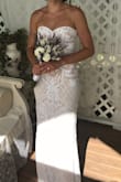 This dress was everything I could have ever imagined! I felt so comfortable, beautiful, and confident in it. I could dance, jump, walk, sit, MOVE!! No bra necessary which was even better since the top fits like a corset with a zipper. I couldn't believe that I got my wedding dress for less than $250. Without any tailoring, I had to wear heels to prevent the dress from dragging the whole night. It was perfect for me. - Alea O.