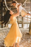 This dress got so many compliments. It's flowy and light. It's very flattering and effortlessly stunning. It's a textured satin kind of fabric so there's a bit of shine but a ton of movement because it's lightweight. I loved it. It was perfect. - Eden B.