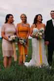 I wanted my bridesmaids to "go" but not be "matchy matchy".  I also wanted each girls style to be true to her personal style.  Searched HIGH and LOW to find the perfect option and this was it!  My bridesmaid and I have different style and this dress perfectly mixed a bit of skin and sex appeal but in an understated and conservative way.  She was comfortable and felt great all day!  She had a hard time finding underwear/spanks but otherwise it was perfection.  How gorgeous were my bridesmaids!?

(For some reason the photos got a bit darker when I uploaded them, but the dress was a nice light blush pink, color is true to website photos) - Alexandra F.