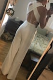 I had been eyeing this jumpsuit for a while, then I decided to order it for my rehearsal dinner. It was very cute and flattering, but the torso area was definitely not long enough for me and it was not possible to wear the jumpsuit. Besides the I'll fitting crotch/butt length on my 5'9 body, it fit nicely! I had to return it. - Kristen L.