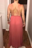 Dress was super cute and loved the strapy back!! Fit as expected, straps were a little tight on the back as I ordered an xs but a small would have been too big everywhere else so it would have been fine. However, the color was slightly off from what the online pictures showed as it was supposed to be a rusty pink but had much more pink than rusty. It was for a wedding and I had to return it because of the color difference. - Rachel G.