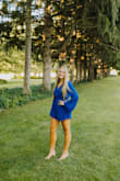 I bought this romper to wear for my senior pictures and it was gorgeous! The blue was a perfect color and it was super soft and comfy. This was one of the only rompers I've bought that was long enough for my body type. - Rachel B.