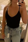 This is the most perfect bodysuit I have ever owned!!! It fits perfectly! And I love that I don't have to wear sticky boobs with it, I could get by with a strapless bra! I ordered black and off white but will be ordering every other color if that's possible!! These can be matched with literally anything!! Love!! - Kristen P.