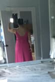 This dress fits so nicely! It's super flattering. Runs a bit big but I wouldn't change the size because I'm fairly large chested. I ordered a Large & it's roomy in the body but overall, I love this dress! The color is super bright in person. I've gotten lots of compliments on this dress already and it's not even 9am yet! - Nannette H.
