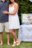 I bought this dress for my engagement party and it was perfect! We had a backyard party in the middle of August and it was the perfect flowy dress to keep me cool and looks adorable on! It is lined so is not see-through which was really nice, especially in the summer outside. I am 5'2" and it was the perfect length dress to wear with wedges. I would recommend this to anyone looking for a more casual white sundress for any bridal/engagement/bachelorette needs! I did have to have it pressed at the dry cleaners because of wrinkles from shipping, but after that it was perfect! - Megan L.