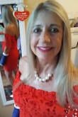 I loved wearing this dress to an event I recently attended. It felt fun and flirty and sexy at 60!

 The Red was a pretty shade-not deep red but red with tinge of orange but not to much.
 
I called in for help with sizing-the consult suggested large for me. It IS a body conforming dress so I'd hoped it had been a little tighter than it is on me....but also I wouldn't  have wanted to go any shorter so I stuck with a Large. 

The fabric is slightly stretchy and the lace was pretty too. 

Thank you to Lulus for the fun evening! - Karen F.