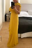I am a bridesmaid in a wedding and needed to find an affordable and flattering long yellow dress. I thought it'd be very difficult to find the right fit, length and style. This is the first dress I ordered or even tried on and it's perfect!!! I ordered both a Medium and Large because I wasn't sure which would fit me best. I kept the Medium as it was ideal for me. On me the Medium could use a little hemming to shorten it by about 2 inches. I want to wear it with a heel and it's still long. It does have an open v-neck which I will have a tailer also put a closure on it for me. Such a great dress for such a great price! - Bethany N.
