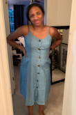 This dress is really cute! I've been going back and forth between a medium and a large since I get a size large sometimes depending on the dress but since it had an elastic back I went with the medium and it fits good! A little tight with the buttons on my upper torso but the large would have been too big. The elastic back is what makes the medium work! - Taylor M.