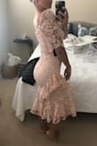 Love this dress in the stock photo but it looked just a bit strange on. The shoulders puffed up and would have to be tailored. Couldn't put my arms above my head. Usually between XS-S, could have gotten away with an XS but wouldn't have been able to move. - Amanda B.
