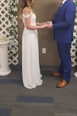 Dress is a beach style. It received so many compliments. I felt very happy and beautiful on a wedding day.
Dress is long so need to hold it while walking.
Before ordering, I have measured myself, also asked advice via live chat. I ended up ordering size M. It was way too big. Then I ordered a size S but it was still a little bit big. Unfortunately, I didn't have time for reordering anymore and already spent money on expedited delivery twice. I think Xs would have been perfect. Overall it is GORGEUS! - Sigita B.