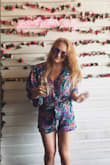 I loved this romper!! I have a short torso and can NEVER find rompers that look good on me but this one was perfect! I have a pretty large bust and I was able to wear a normal non padded bra with the top hooked/buttoned and it was just the right amount of cleavage without being too out there. The sleeves are a little longer than I was expecting, came down past my elbows but I still loved it none the less. Got SO many compliments at brunch. Would definitely recommend this little romper for a fun day time event! - Jessica J.