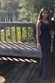 The dress looks exactly how it's shown in the pictures on the website. Great fabric quality! Loved the color! But I did have to get it tailored since it was really long for my height but after getting it fixed, it fit perfectly. Highly recommend this dress! - Angela F.