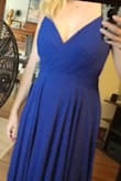 This dress fit perfectly through the midsection, and though I didn't quite fill it out without a bra you can go without (pic is without). You can also easily wear a deep v strapless (or even a regular deep v bra with the straps just tucked in). The only issue I had was the hem was very uneven. I would have had to address that had I not gone with a different dress. Also of note: this dress is HEAVY. The multiple layers of fabric make it flow beautifully, but it definitely weighs on you. - Erin W.