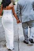 I loved loved loved my dress. I wore it when I got eloped in Savannah and it fit me like a dream. I got a strapless push up bra because I had like no cleavage if I went completely bra less but it prob would have been fine. ESP if you want a more conservative look. It hugged my curves just right! I wore 3 in heel and chose not to have it hemmed so I could have some length while I took pics but If I had had to walk down an aisle I def would have needed some inches off. - Signy J.