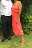 Wore this dress to a summer garden wedding. I loved the color and the great ruffles detail. The fabric has a slight shine to it and I didn't need to accessorize much. Perfect for dancing, too, as it flows with you. The shoes are also from Lulus and matched the dress perfectly. - Laura V.