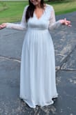 Sleeves was a little loose but still beautiful. Rest of dress fit perfectly! My husband and I got married at courthouse and I had so many compliments. And the price was so cheap for such a beautiful dress!!!!!!! Not made cheap neither! I highly recommend.
A little long but great with heels... - Angela S.