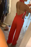 Love this jumpsuit. So unique. Material is soft and flattering. I usually have a problem finding jumpsuits long enough in the torso, but this is plenty long (I've even ordered an X-Small to see if it fits better)
Legs are long and will need to be hemmed, but that's to be expected.
Will have to wear some pretty skimpy "sticky boobs" since the front cuts in pretty flat against the front part of my chest, but the jumpsuit as a whole is super fun! - Mariah S.