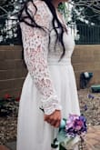 Beautiful dress. Wore for my wedding. Had to alter the sleeves and length, also needed hemming at the waist. Good quality material! - Ashlee M.