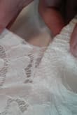 Chose this dress for my budget-friendly wedding dress. When it finally was delivered I tried it on immediately only to notice the chest section of the lace was already becoming detached from the midsection seam. It was frayed at the seam several inches on the front in a way that was un-fixable without having additional fabric to work with. Also the back lace was starting to separate from the seam as well, that probably could've been fixed but due to the front I ended up contacting customer service to get a return started and am currently waiting on a refund. BUT, I will say the customer service was excellent to deal with and although this was unfortunate, they have definitely felt like my concerns have been prioritized and actually mattered. One of the best places for customer service I've dealt with before.

Other opinions of the dress - fits fairly true to size but is definitely form fitting, I would size up if you are between sizes in chest/waist. Very beautiful otherwise and very flattering, except for the bottom hem which several people have commented on - the lace is shorter than the under-layer and it's super weird. If hemmed, a L on a 5'7" person makes it way to short, standing flat foot you can see your feet already. Had I kept it I would've probably taken out the seam or added more lace or something to make it more poofy/look longer. - Danielle H.