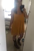 Loved this dress, it does sit loose, but it's supposed to. It is flowy and comfortable, and the under layer is thick so not see through at all. I packed it in a suitcase, and it was wrinkled when I got to my destination, but I hung it in the bathroom when I took a shower and the steam took the wrinkles right out! - Natalie L.