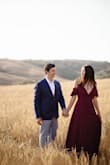 This dress was SO perfect for the location in Tuscany we chose for the engagement shoot. It was such a pretty burgundy and complimented the golden tones beautifully. Such a gorgeous color and great quality! I'm almost always a medium but after reading the reviews about it running a little large and since there was only a small left, I went with the small and it fit pretty well. The waist was a little tight, but as it is a wrap dress I think it worked. If it was available in the medium, I think I would have been more comfortable. Definitely get your size if you have a large chest though. Also, it flows really nicely when the wind is blowing! - Jaclyn H.