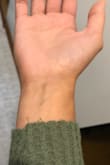 I love the material (very soft and stretchy), the way it fits (loose and comfy), the color, pretty much everything about it EXCEPT..... there's not a chance it holds up to washing! I was so disappointed to find there is no sewing to prevent it from unraveling at the bottom or on the sleeves (and it definitely will unravel) I didn't want to spend that much on a top to have to sew it myself! With that being said while I wouldn't buy another one, I definitely do plan on sewing it myself and wearing it. - CHRista M.