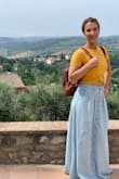 I absolutely adore this skirt! I loved pairing it with my yellow and white crop tops and a sun hat. Material is lightweight and easy to iron. The waist fit perfect on me and is just a tad long with flats but perfect with wedges and heels. (I don't have particularly long legs but also don't have short enough legs to qualify as petite.) Definitely recommend. - Michele H.