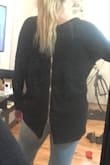 I had high hopes for this sweater. The material is very thin and cheap, the zipper is cheap and hard to move, honestly it doesn't look like a sweater at all and more like a cheap shirt with a bad neckline. It is still cute from the front but looks cheap from the back. Runs large as it is supposed to be oversized, if I keep it I will get a smaller size. - KATELYN L.