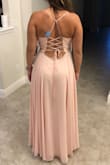 I bought this dress to wear as bridesmaid in my friends wedding. It fits great and is super comfortable! I love the back because you can tighten as needed. I only needed to get it hemmed. - Marissa C.