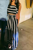 This 2 piece outfit is so cute and trendy. The bottoms are a little small, it felt really snug on my waist. The bottoms are also very long. I am 5'7 and they were still dragging, but if you wear high heels then that probably won't be an issue! The top was true to size and a perfect fit. - Stephanie S.