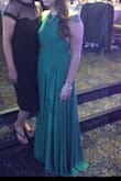 LOVED the color green! The dress wasn't tight which is what i wanted. It was so comfortable! I was able to move and eat without feeling like i was going to burst out of it. The straps in the back are adjustable which i really loves as well. The length was perfect with heels but i was stepping on it a lot when i took my shoes off. If you are shorter you will need to get it hemmed. - Jennifer D.