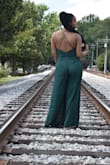I ordered this romper in both a medium and large. I kept the medium but I should've kept the large. The medium fits super snug when standing. I should've sat down in it because when I wore it to a wedding it was constantly riding like a thong. I have a long torso so the large would've been better. I kept the medium because it fit my bust, but in the end it was too small. - Jasmin C.